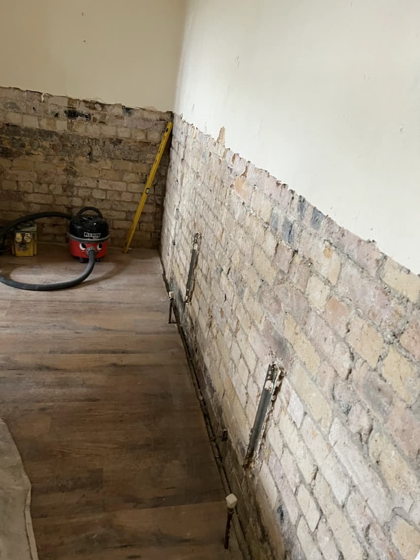 Completed damp proofing and plastering project showing quality workmanship